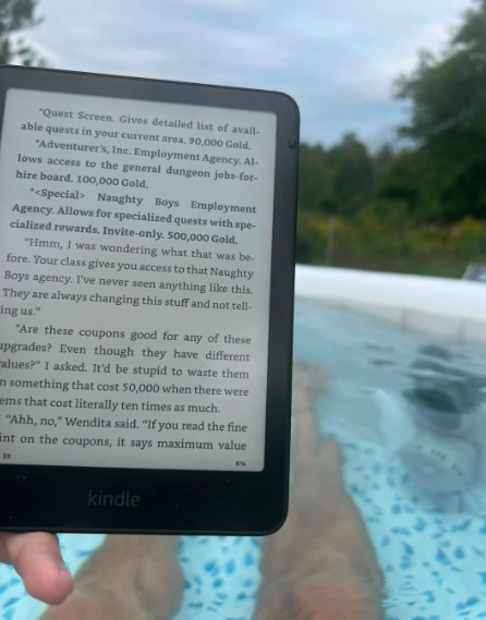 A Kindle held over a swimming pool
